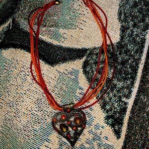 red and orange necklace with heart